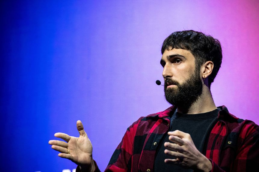 Aidan Gomez, CEO and co-founder of Cohere, speaks at the Palais des Congres in Montreal on September 16, 2026. All In is Canada's largest artificial intelligence and technology event.