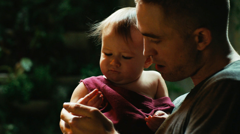 Robert Pattinson's Monte holds Scarlett Lindsey's baby Willow in High Life