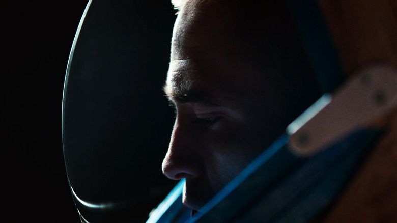 Robert Pattinson's Monte is seen throug the visor of his helmet surrounded by black in High Life