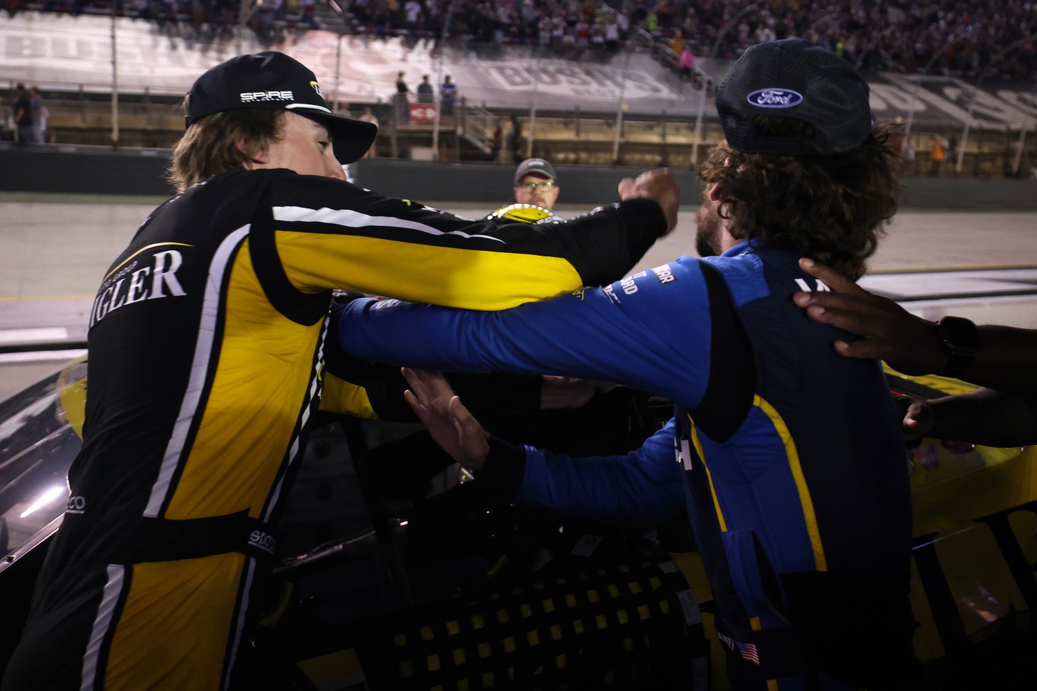 Carson Hocevar, driver of the #77 Zeigler Auto Group Chevrolet, (L) and Ryan Blaney, driver of the #12 WABASH Ford, get into an altercation after the NASCAR Cup Series Bass Pro Shops Night Race at Bristol Motor Speedway on September 19, 2026 in Bristol, Tennessee. (Photo by Chris Graythen/Getty Images for NASCAR)