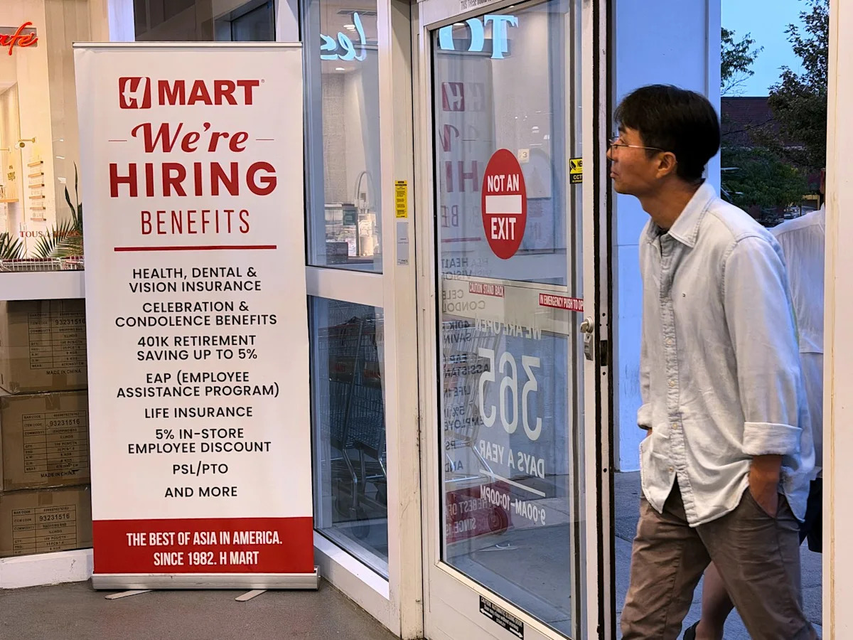 Claims for unemployment benefits drop to 197,000, the lowest since mid-July as layoffs remain rare