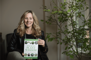 CEO of Nature Provides and Innovative Health Leader, Jenn Payeur, holds her book, Ancient Plant Wisdom: How to Improve and Maintain Your Health Using Concentrated Plant Stem Cell Remedies