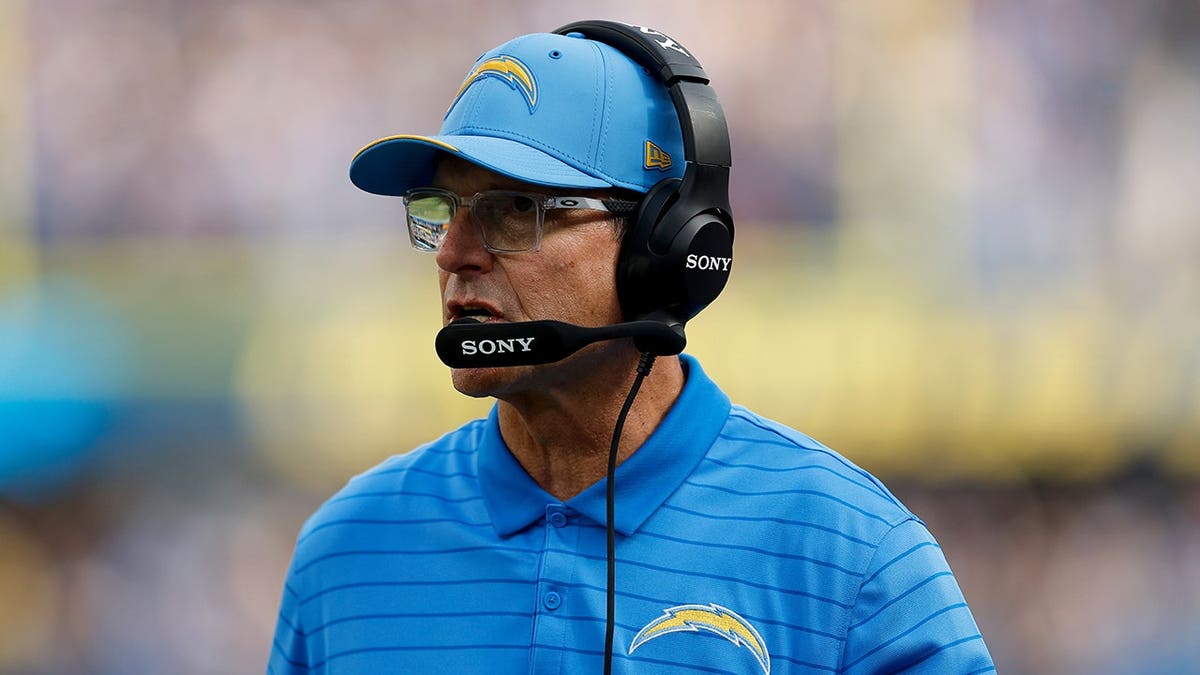 Jim Harbaugh reacts from the sideline during an NFL game against the Arizona Cardinals.