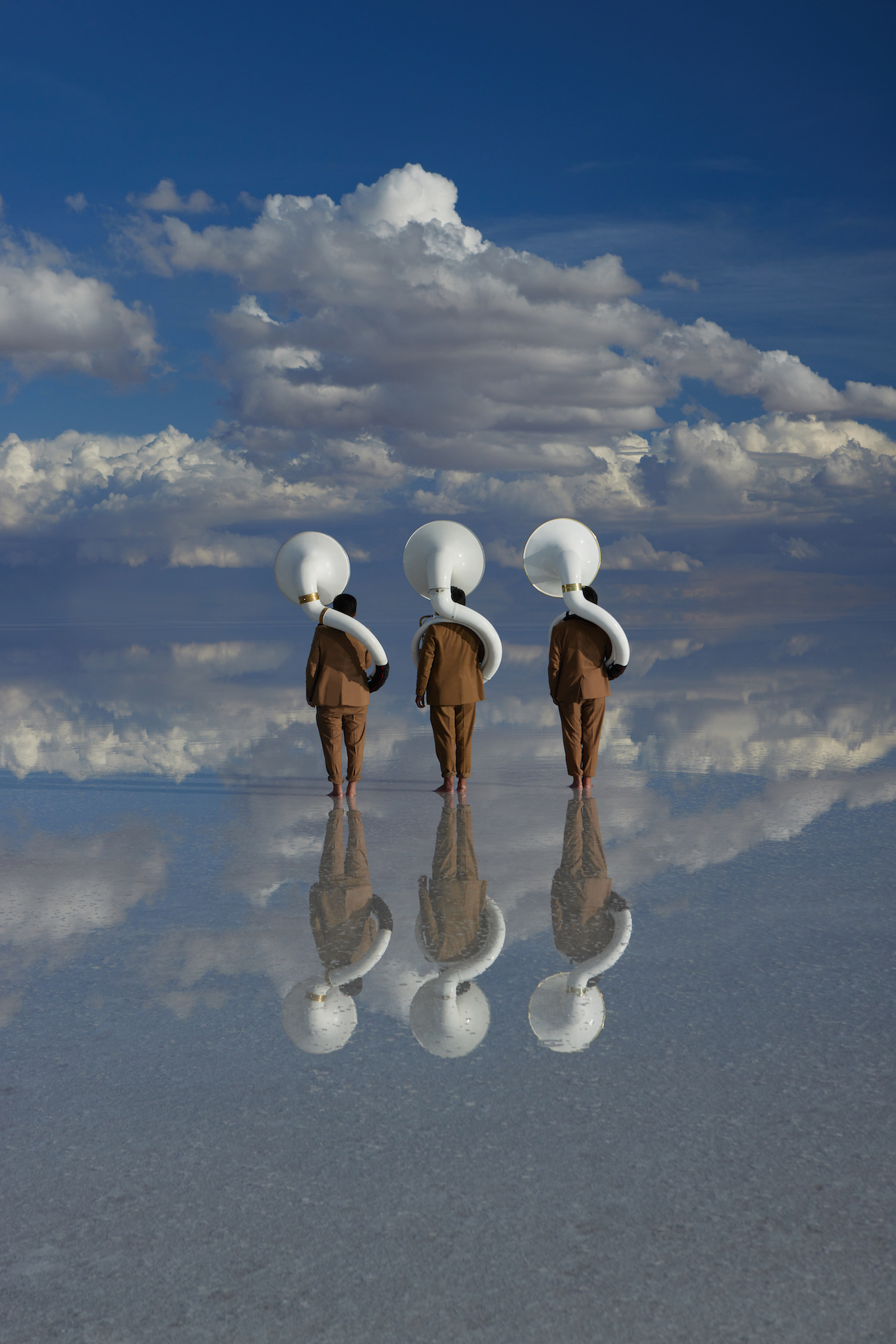 Photograph of men with 3 white brass instruments taken by Julia Buruleva