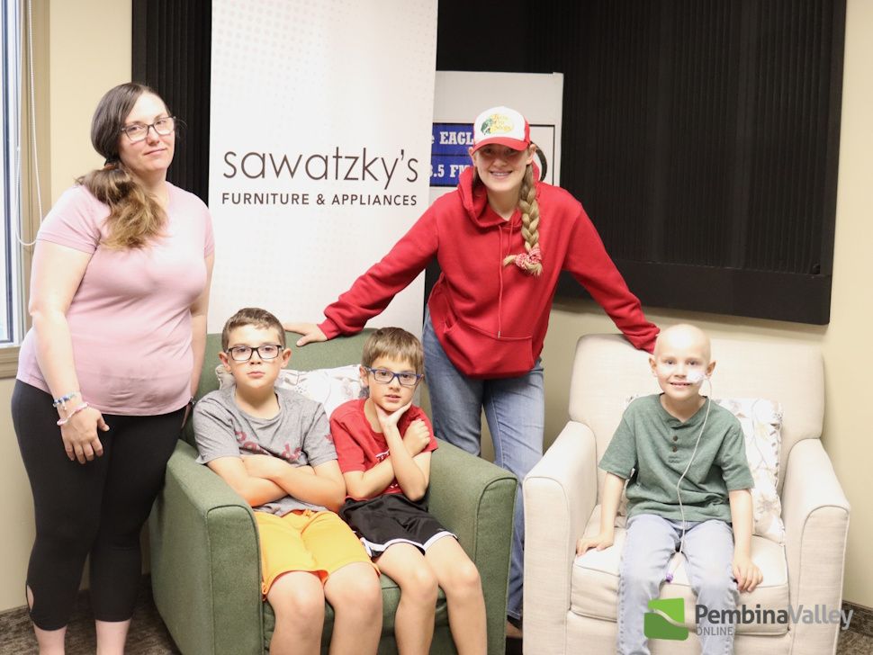 Helena, Tyler, Logan, Emma, and Maverick Friesen in the Eagle 93.5 studio.
