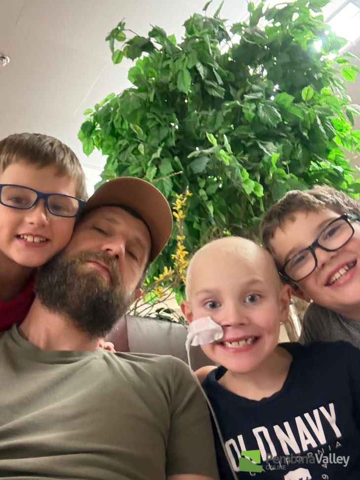 Logan, Maverick's dad, Maverick and Tyler in a group selfie