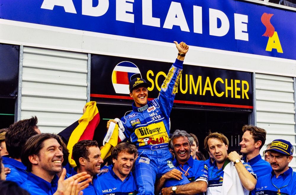 Michael Schumacher celebrates championship victory with his team