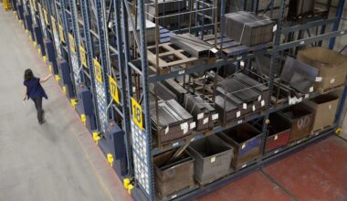 Large industrial shelves are seen from a high angle in a warehouse.