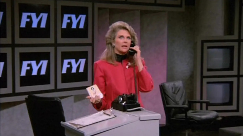 Candice Bergen as Murphy Brown talks on a phone on Murphy Brown