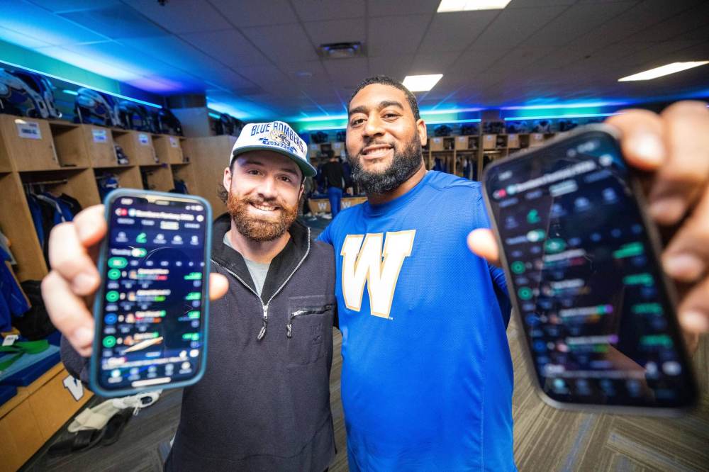 MIKAELA MACKENZIE / FREE PRESS
Winnipeg Blue Bombers punter — and commissioner of the team’s NFL fantasy football league — Jamieson Sheahan (left) and teammate Micah Vanterpool after practice Wednesday. Vanterpool said the league is great for building club-wide camaraderie.