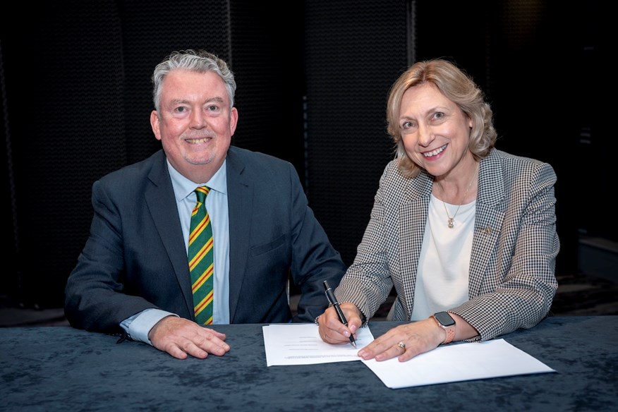Royal Aberdeen Golf Club captains Laurence McLeod and Carron Taylor sign the historic transfer agreement to unite the clubs.