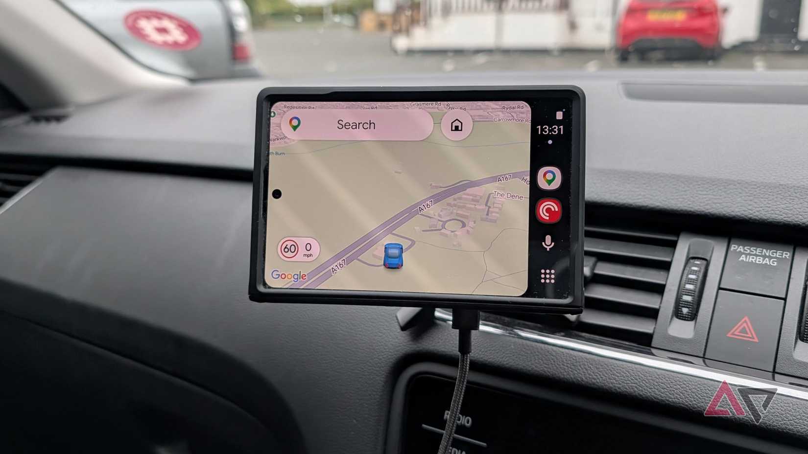Turning the phone sideways, as God intended, so Android Auto is actually usable.