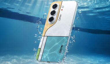 A Tecno Camon smartphone with a multi-colored geometric back panel floats underwater surrounded by rising air bubbles.