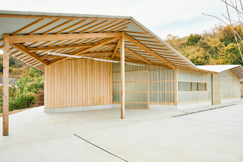 triangular timber structure encloses tsukumo kiln ceramic studio in kobe, japan - 4