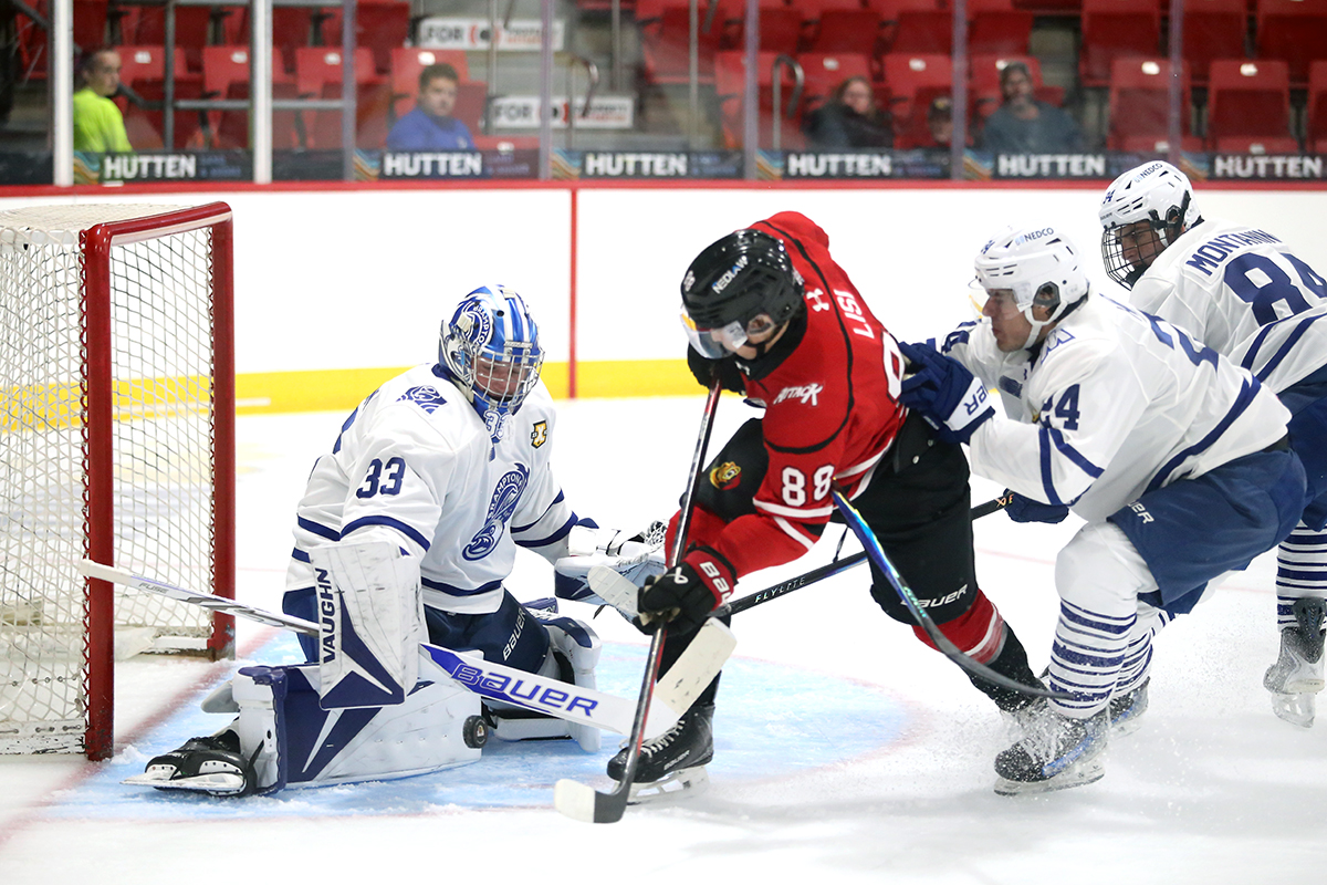 Alex Lisi tries to find the rebound in front of goaltender Neillan Johnson as the Owen Sound Attack play the Brampton Steelheads in preseason action inside the Bayshore on Thursday, Sept. 10, 2026. Greg Cowan/The Sun Times