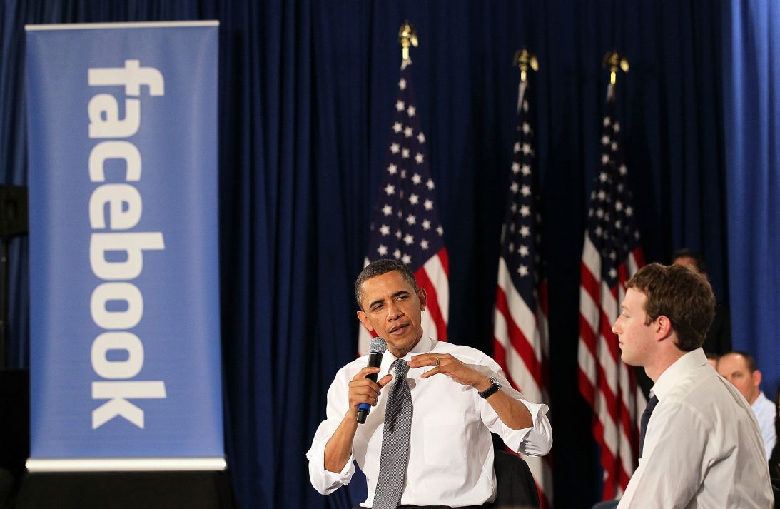 Then President Barack Obama talks with Facebook CEO Mark Zuckerberg during a town hall meeting at Facebook headquarters in 2011.