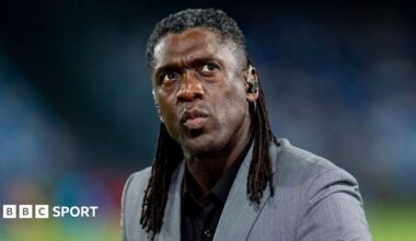 Clarence Seedorf working as a pundit before Napoli's Champions League match against Arsenal in September, in grey jacket and black shirt