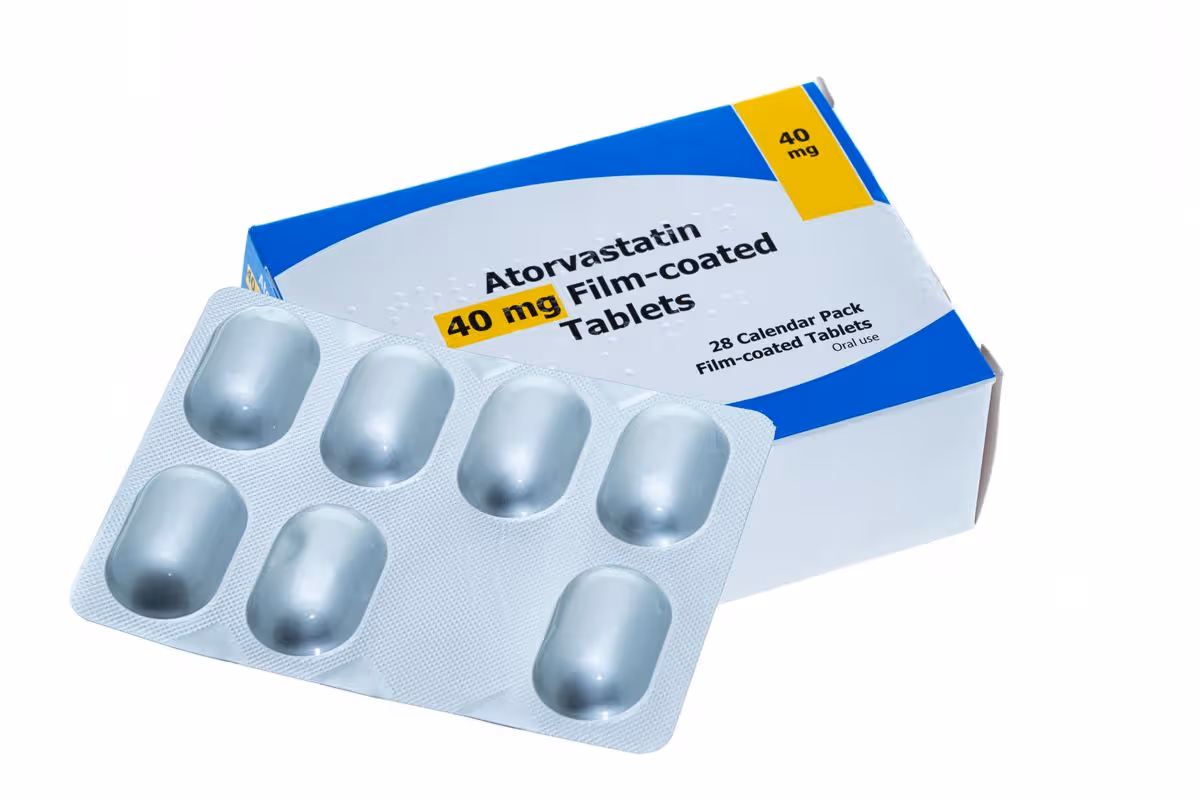 A generic box and blister pack of Atorvastatin tablets - white background. Atorvastatin is a member of the drug class known as statins.