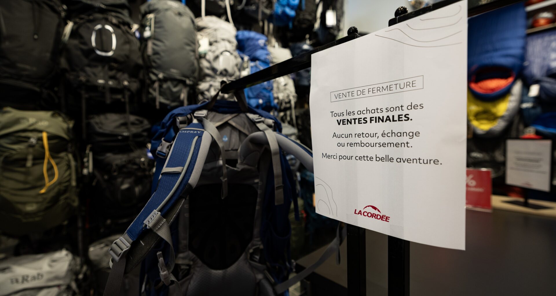 A sign on a door advises of a closing sale with no refunds.