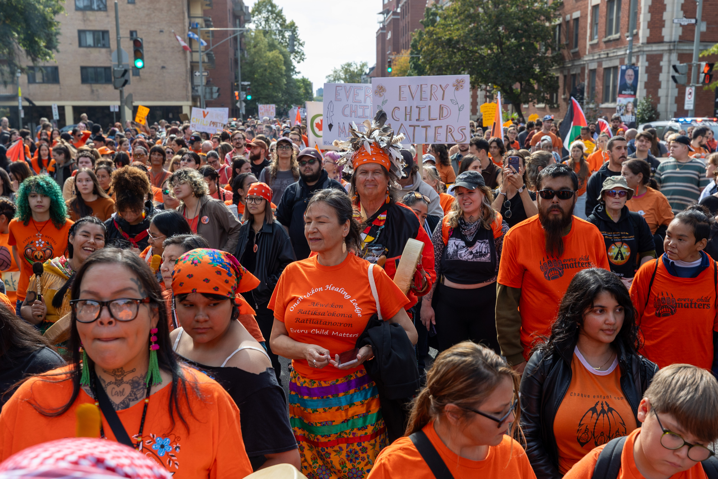 A large group of people take part in a public march.