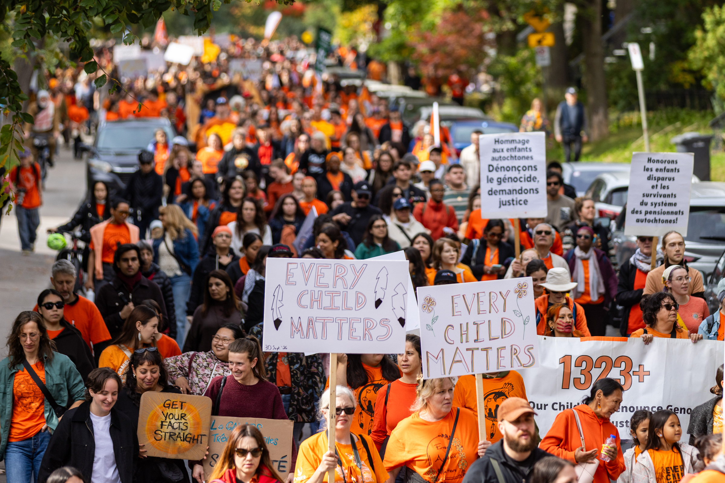 A large group of people take part in a public march.