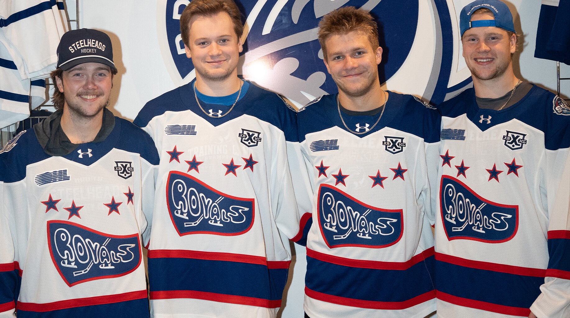Four hockey players wearing Cornwall Royals jerseys