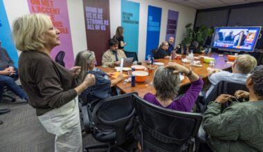 TALQ director general Sylvia Martin-Laforge, left, joins members watching the provincial election results at their office in Montreal on Monday night.