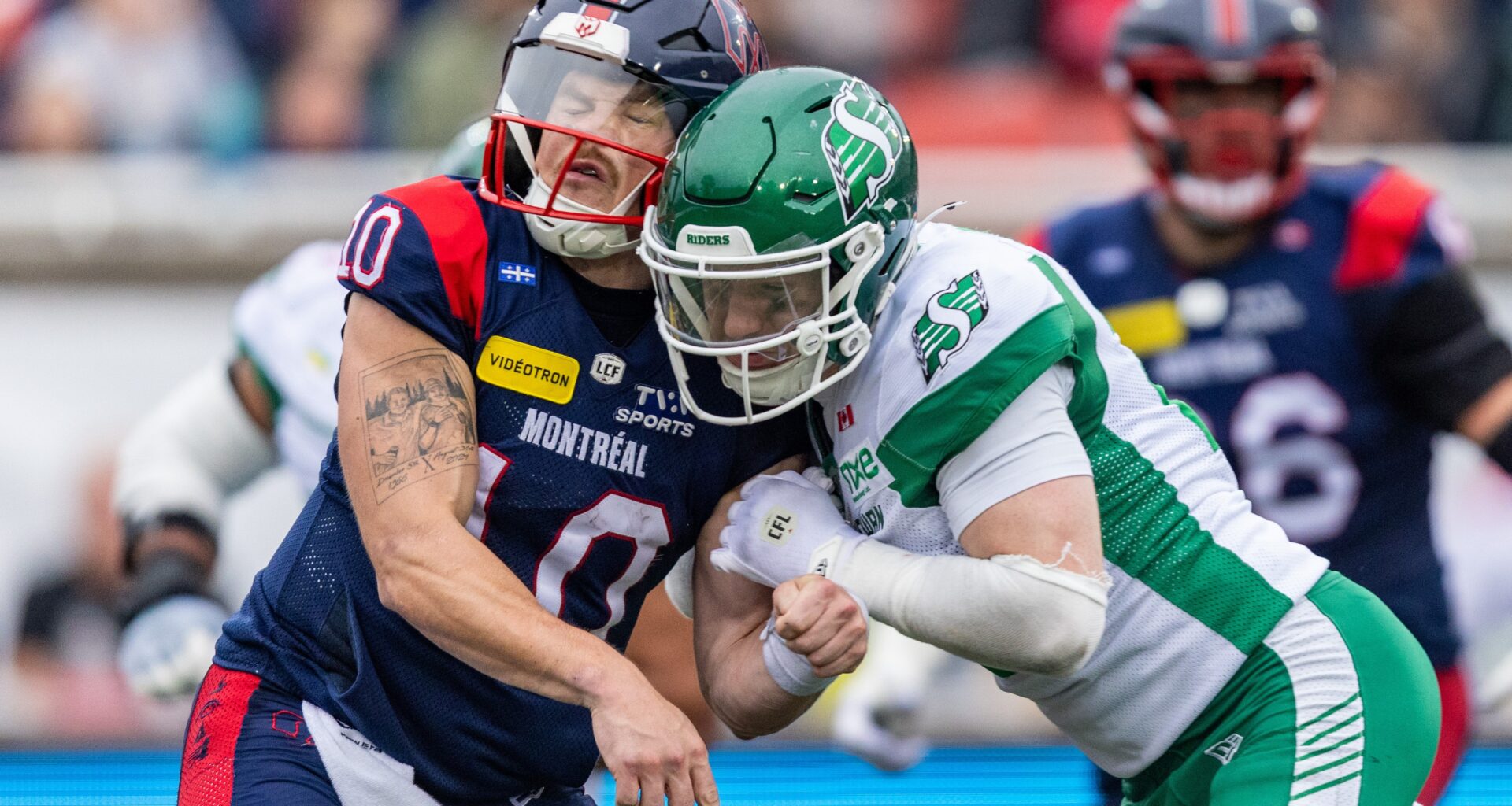 Montreal Alouettes quarterback Davis Alexander (10) is hit the head by Saskatchewan Roughriders defensive back Jaxon Ford (21)during the second half of a Canadian Football League game in Montreal on Monday, October 12, 2026. (Evan Buhler / MONTREAL GAZETTE)