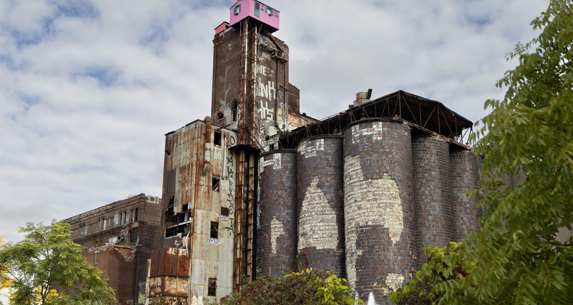 the dilapidated former Canada Malting plant is seen with the iconic pink house atop it.