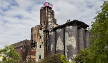 the dilapidated former Canada Malting plant is seen with the iconic pink house atop it.