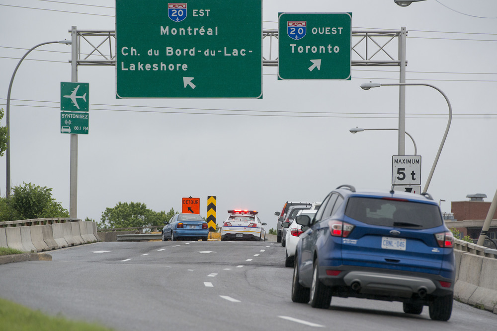 Signs on Highway 20 in Montreal show exits for Montreal and another for Toronto