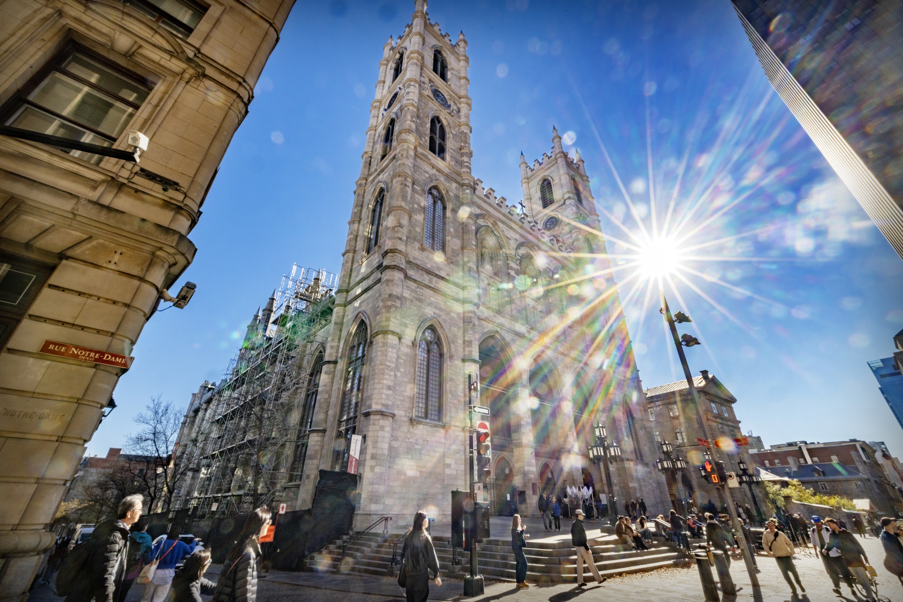 People congregate in front of Montreal's Notre-Dame Basilica