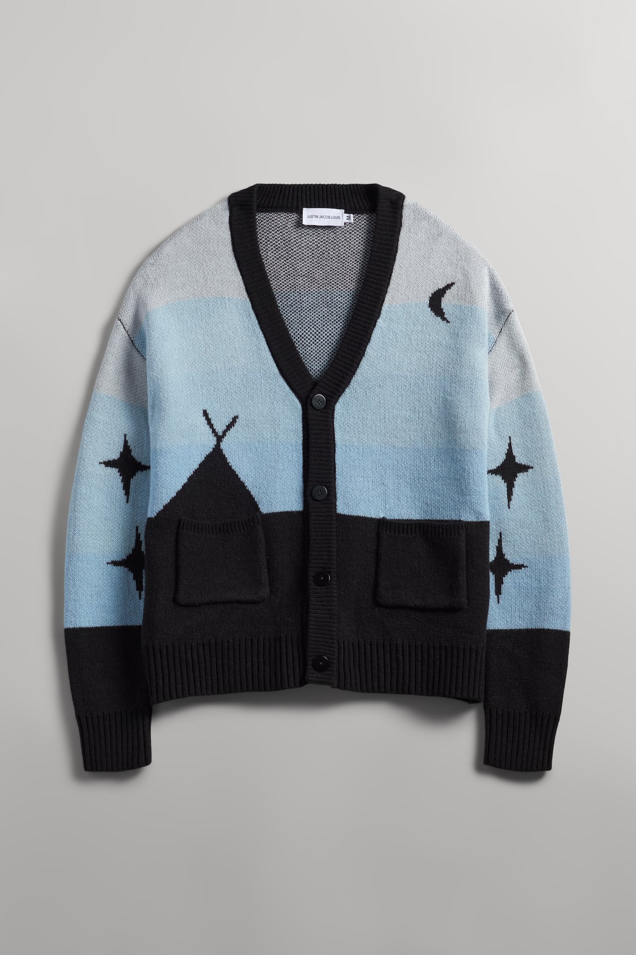 photo of a blue and back indigenous designed cardigan