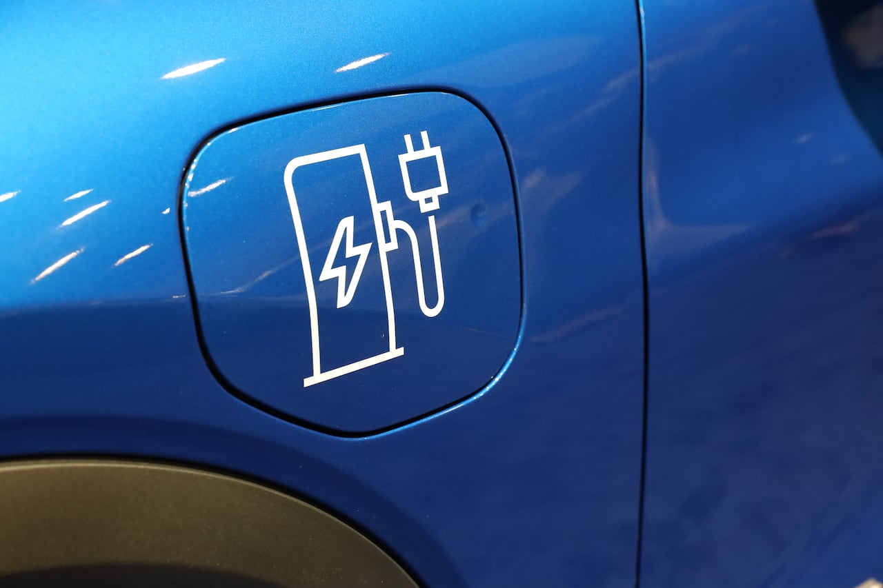 An electric vehicle's charging port is displayed at the 2026 Canadian International AutoShow in Toronto.