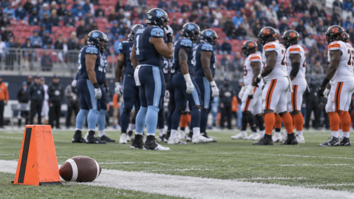 Toronto Argonauts result story illustration of a football and players on a field