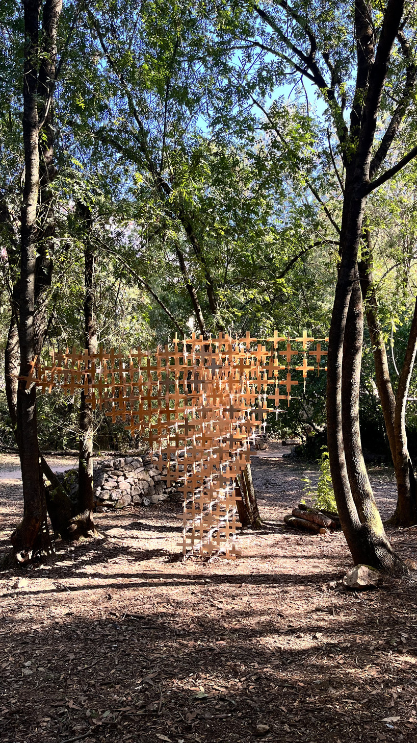 interlocking biodegradable modules weave regenerative pavilion into gavarres landscape - 3