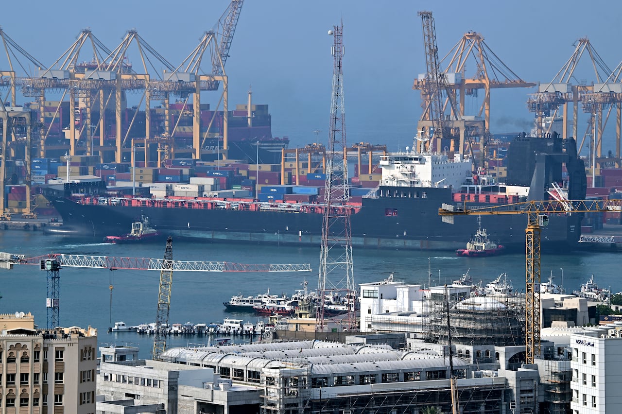Ships are docked along a pier.