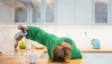 Tired woman sleeping on the table in the kitchen at breakfast. Trying to pour morning coffee into mug but spilling on to the counter