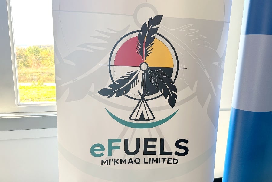 A banner is shown with a logo showing a teepee topped with wind farm blades made from feathers.