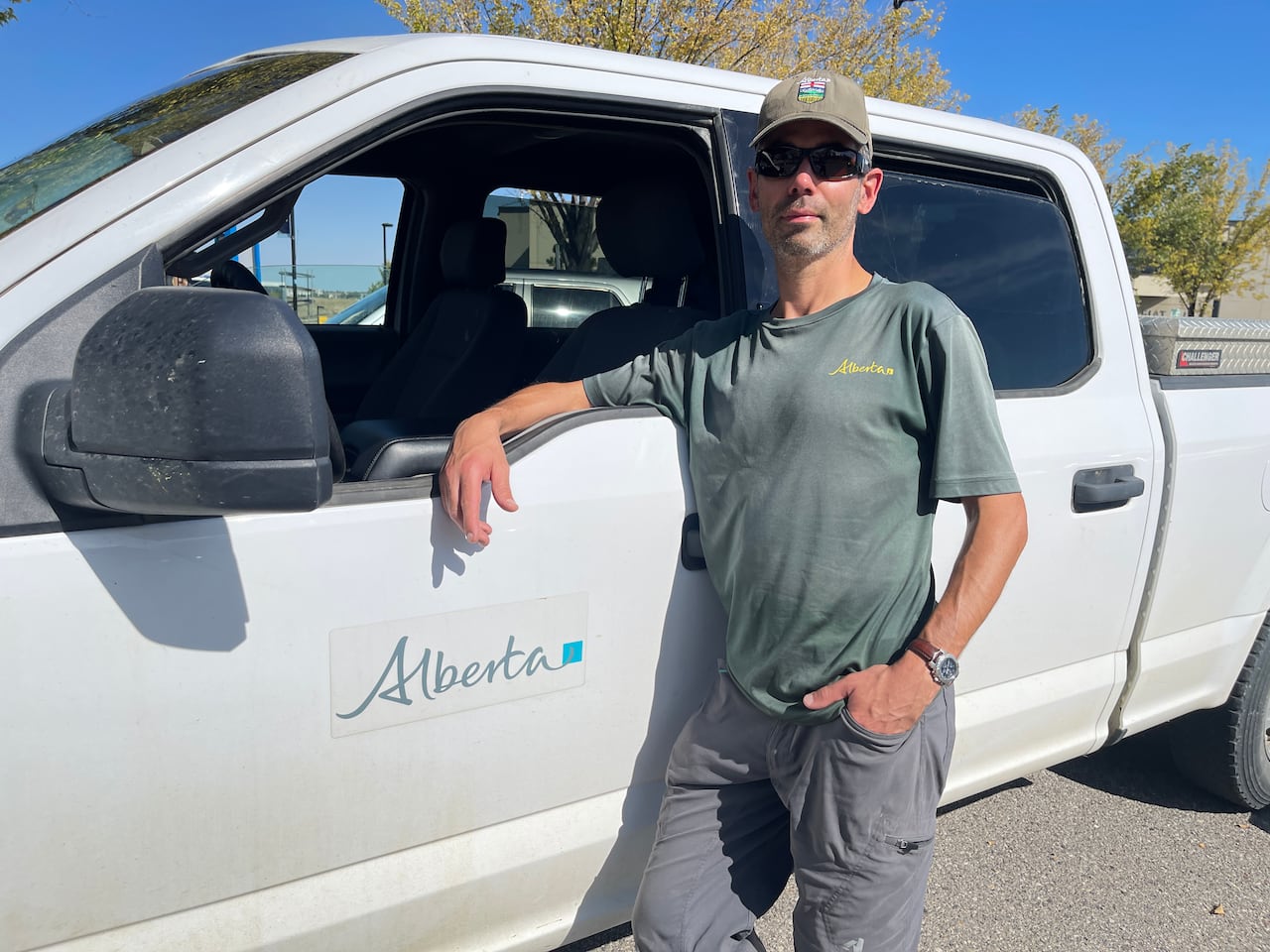 A man beside a truck.