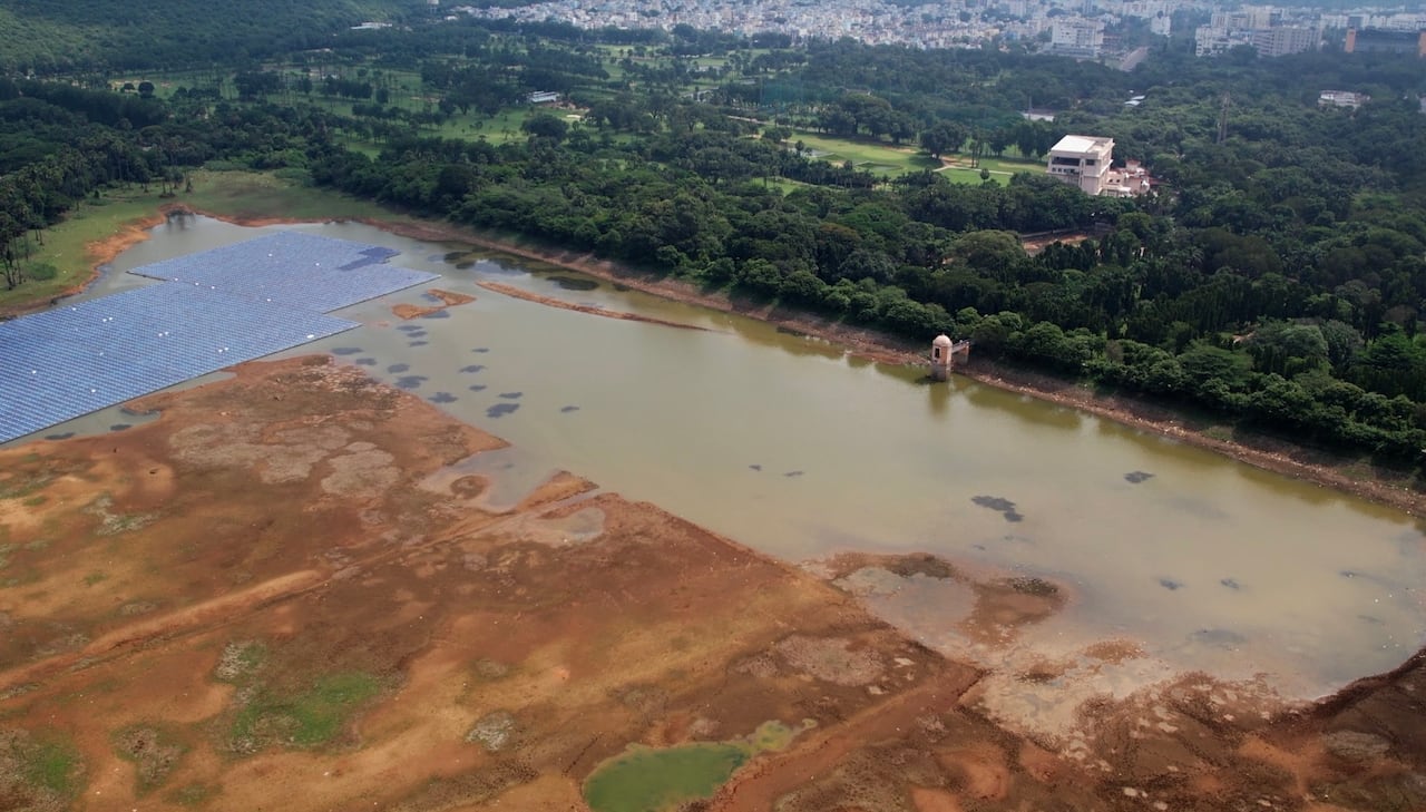 An aerial shot of a nearly empty reservoir.