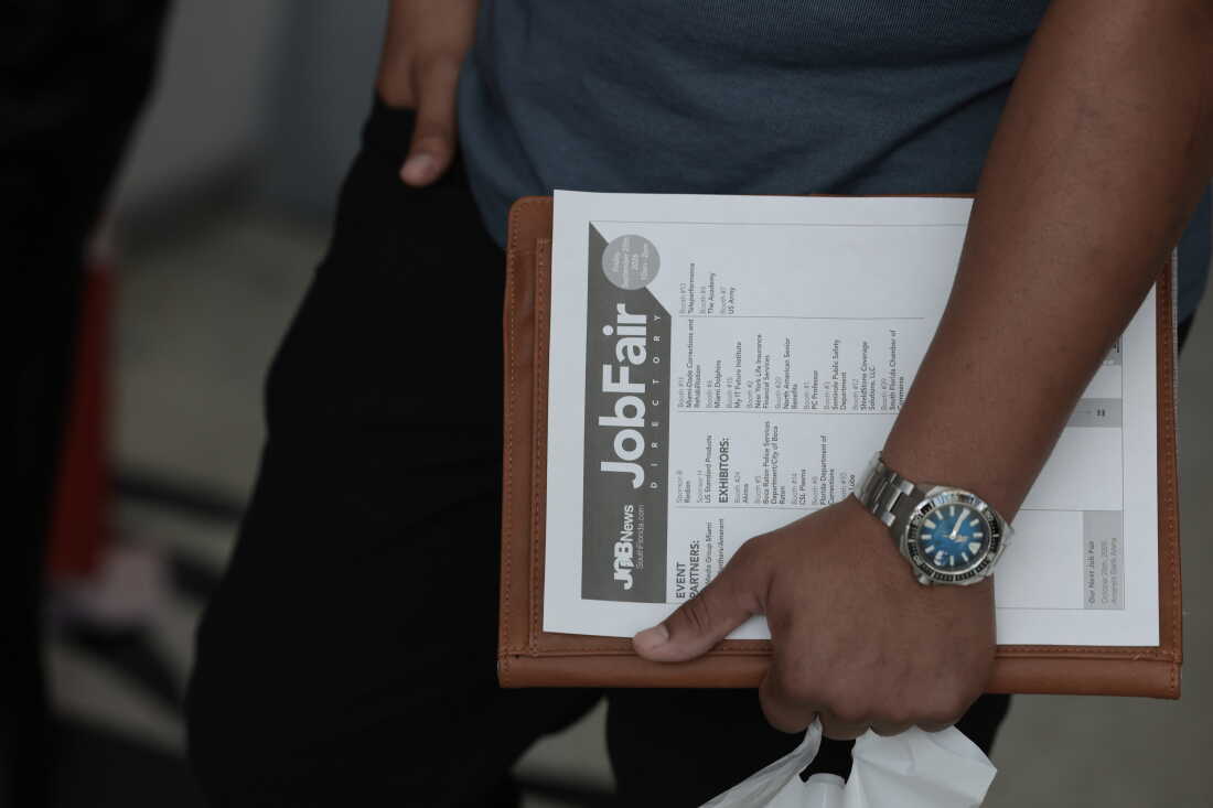 SUNRISE, FLORIDA - SEPTEMBER 25: A job seeker holds paperwork during the Mega JobNewsUSA South Florida Job Fair held in the Amerant Bank Arena on September 25, 2026 in Sunrise, Florida. Hiring managers and recruiters from more than 50 companies attended the job fair to recruit workers for opportunities across a range of companies. (Photo by Joe Raedle/Getty Images)