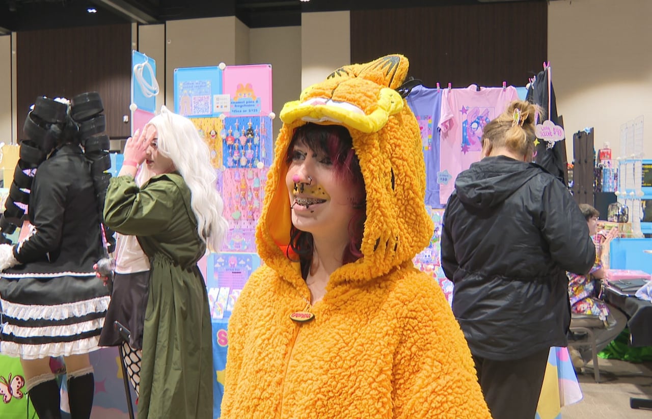 A young person in a Garfield suit.
