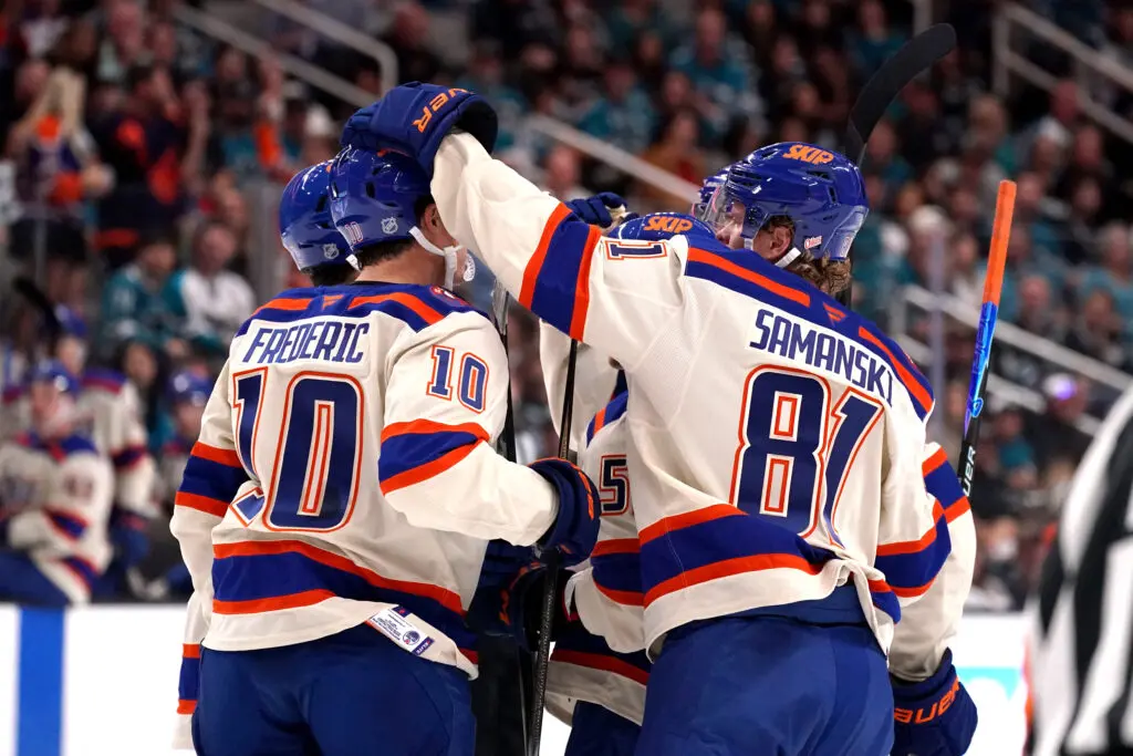 Edmonton Oilers celebrate goal cream jerseys