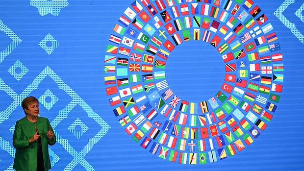 IMF warns of risks from AI boom and debt, but raises forecast for world growth