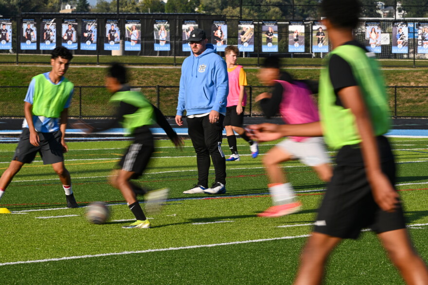Matt Davison, an assistant coach, watches players at practice.