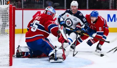 Montreal Canadiens goalie Jakub Dobes (75) makes a save against Winnipeg Jets center Jonathan Toews (19) during overtime at Bell Centre.