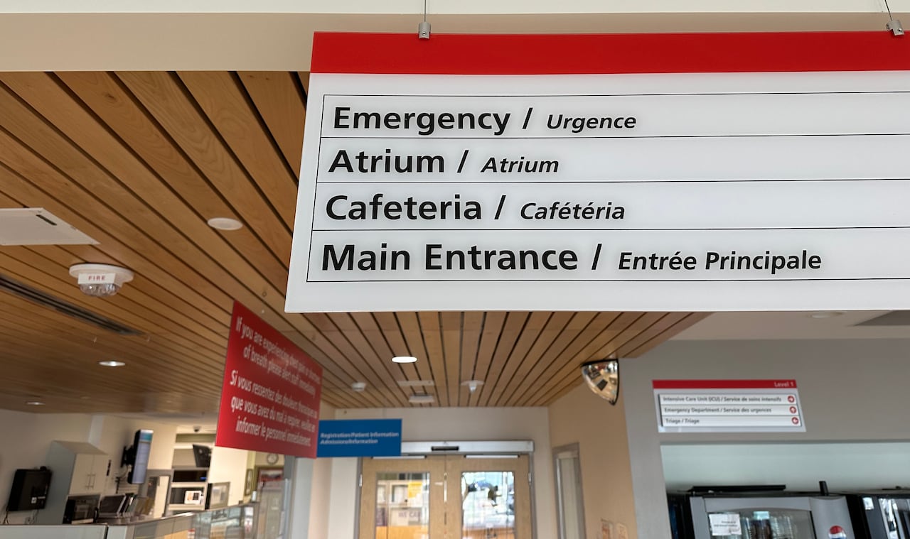 A sign inside the Whitehorse General Hospital's emergency department directs patients and visitors.