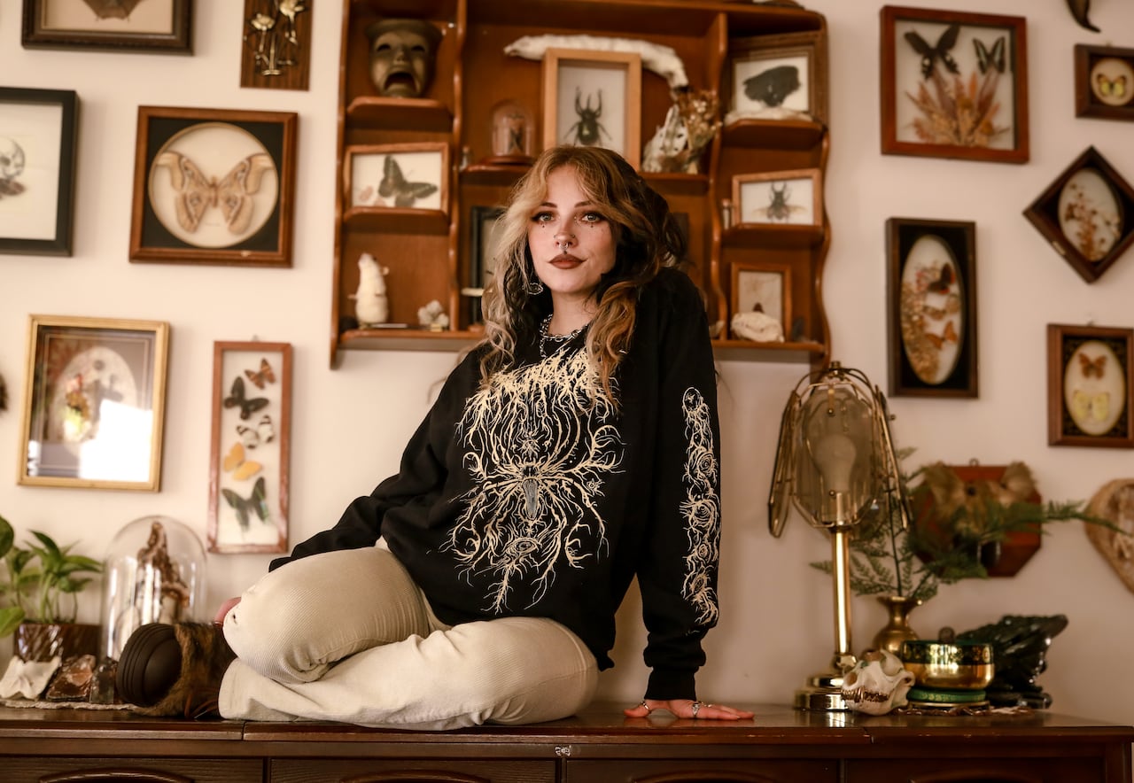 Amy Brandley sitting on top of a table.
