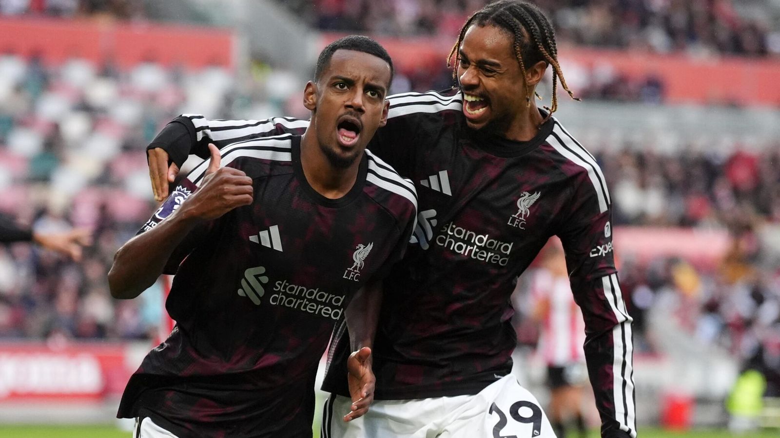 Alexander Isak celebrates with Bradley Barcola after firing Liverpool into a 2-1 lead